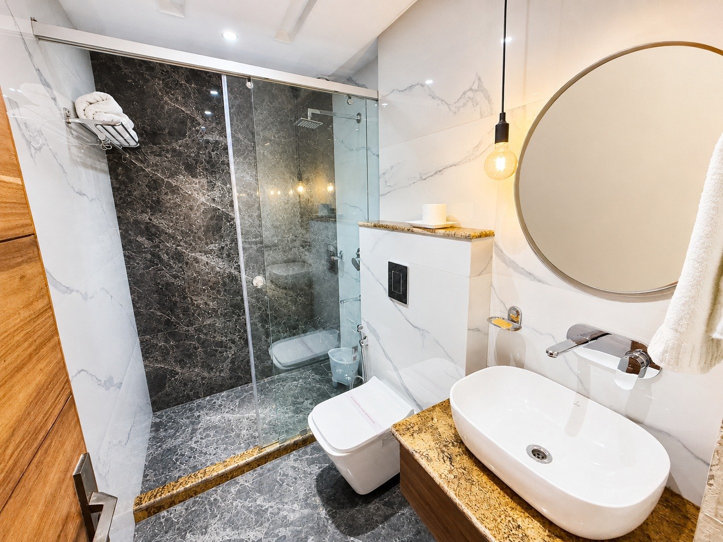 Marble bathroom with glass shower and vessel basin