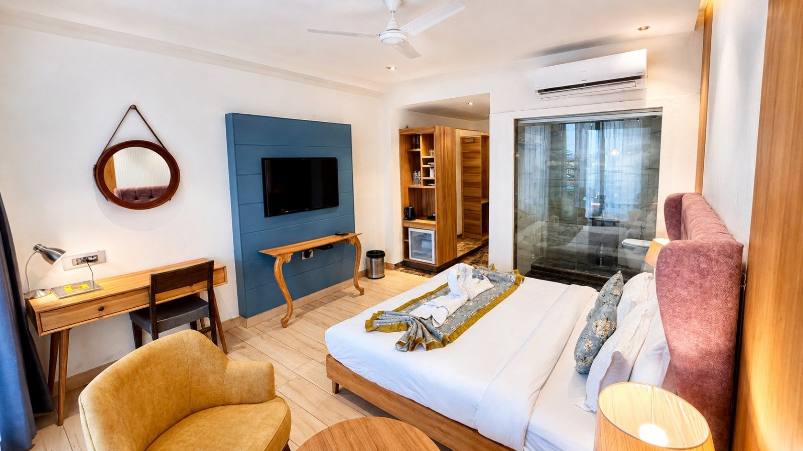 Spacious suite with king bed, sitting area and work desk