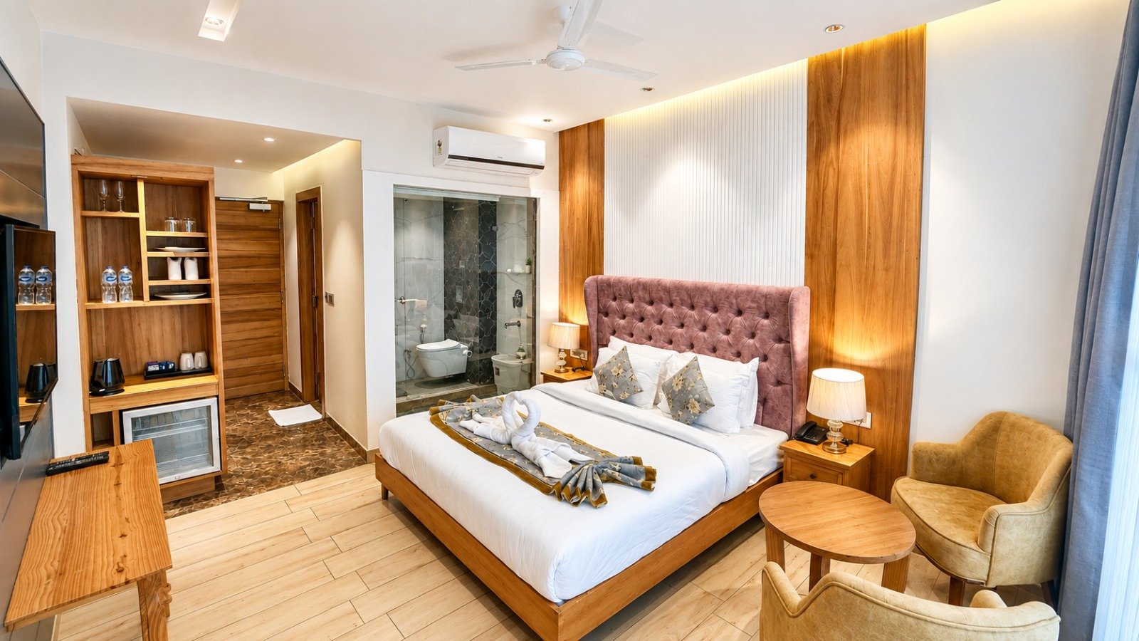Room with tufted headboard, wood panelling and sitting corner